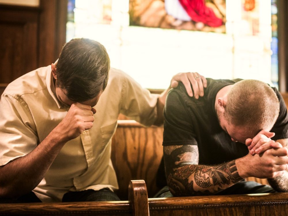 Two men praying together, seeking God, prayer, trust in the Lord,