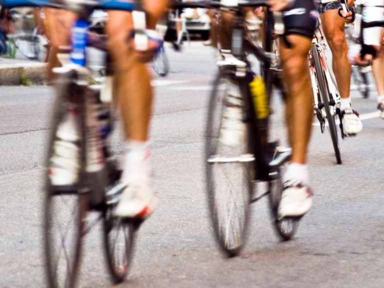 In a Tour de France cycling team, eight riders work collaboratively to provide the best position for their star rider to win.