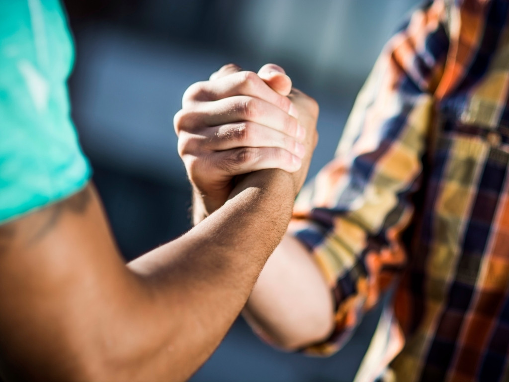 Friends shaking hands