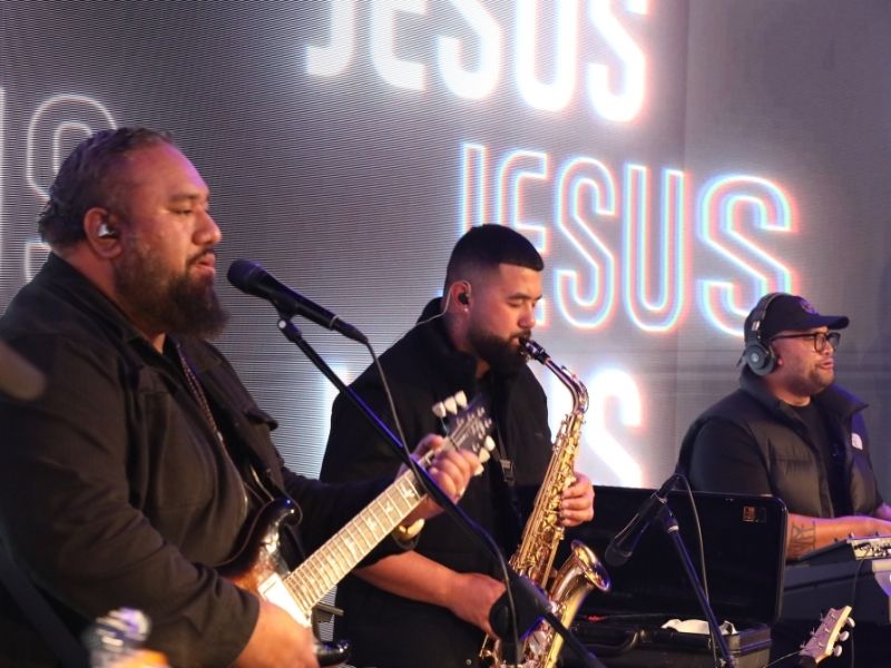 Musicians praise Jesus by playing their instruments at Promise Keepers Auckland