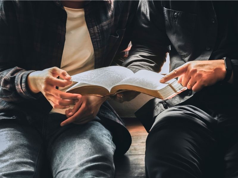 Men studying the Bible together